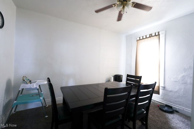 dining room featuring carpet flooring and ceiling fan