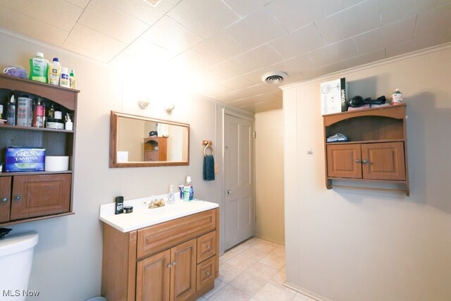 bathroom featuring toilet and vanity