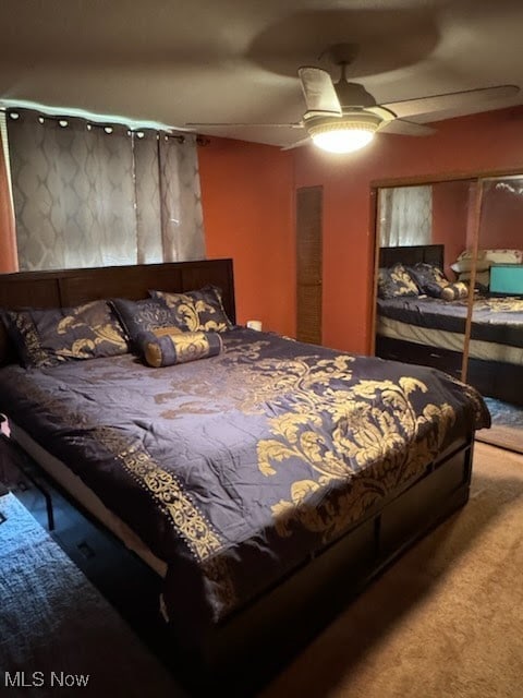 carpeted bedroom with ceiling fan