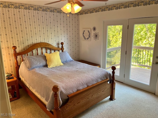 carpeted bedroom with ceiling fan and access to outside