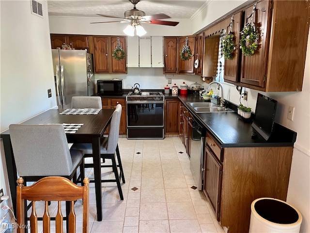 kitchen with a textured ceiling, sink, black appliances, ceiling fan, and ornamental molding