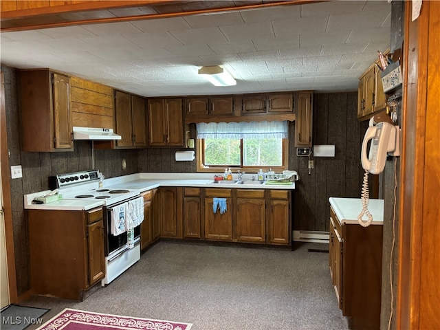 kitchen featuring a baseboard radiator, wood walls, sink, and white electric range oven