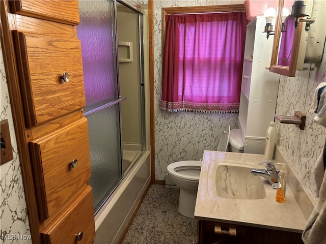 full bathroom with vanity, toilet, and enclosed tub / shower combo