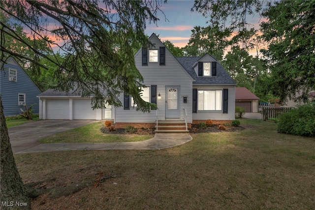 new england style home featuring a lawn