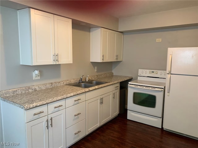 kitchen with white cabinetry, dark wood-type flooring, white appliances, and sink