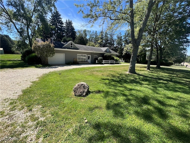 view of front of house featuring a garage and a front yard