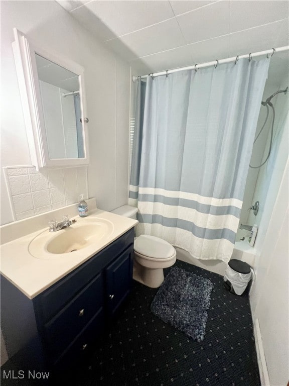 full bathroom featuring vanity, tile patterned flooring, toilet, decorative backsplash, and shower / bath combo