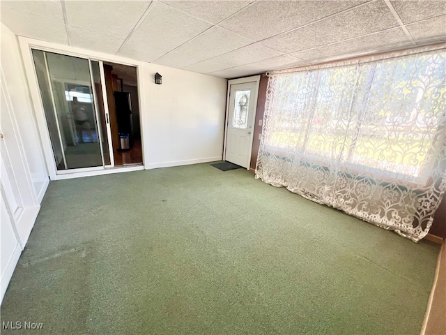 unfurnished sunroom featuring a paneled ceiling