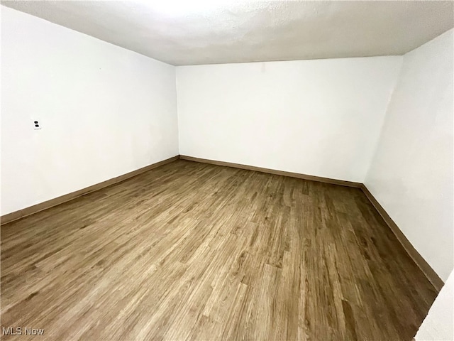 unfurnished room featuring hardwood / wood-style flooring