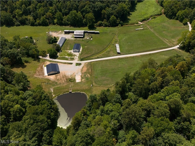 birds eye view of property with a rural view and a water view