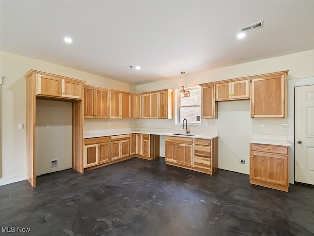 kitchen featuring pendant lighting and sink