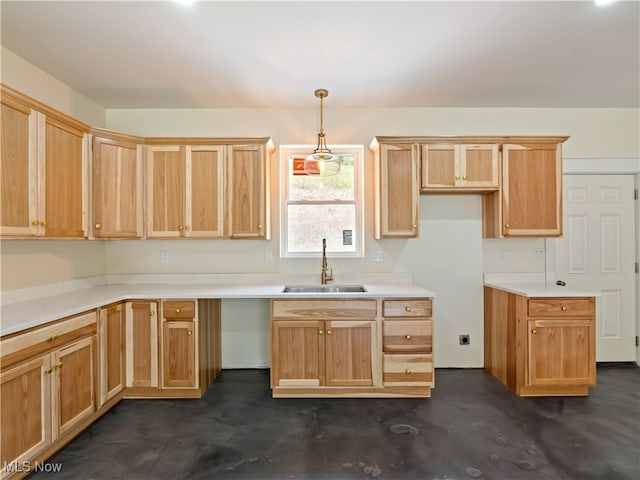 kitchen featuring decorative light fixtures and sink