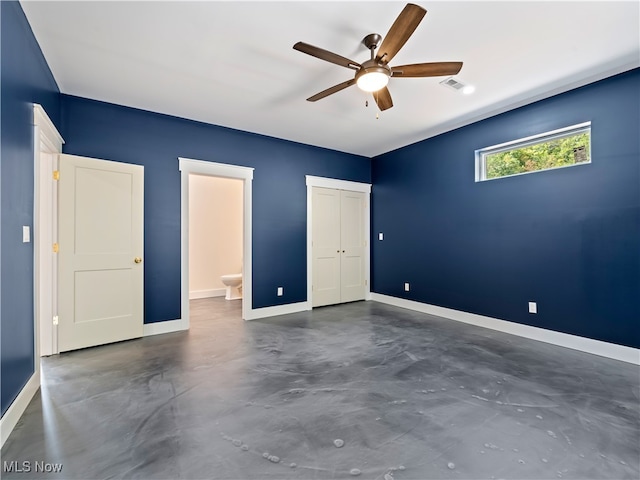 unfurnished bedroom with ensuite bath and ceiling fan