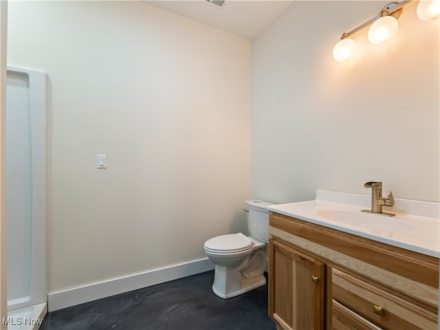 bathroom featuring vanity and toilet