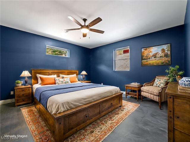 bedroom with ceiling fan and dark hardwood / wood-style floors