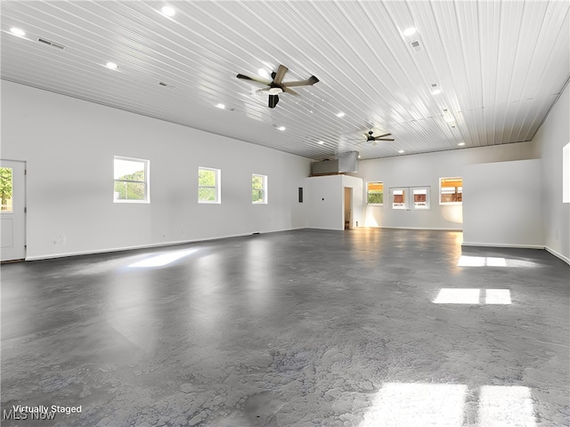 garage featuring ceiling fan and wood ceiling