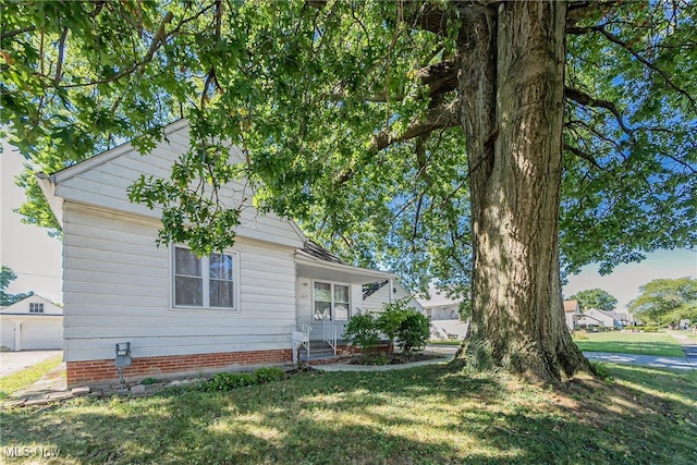 view of home's exterior featuring a lawn