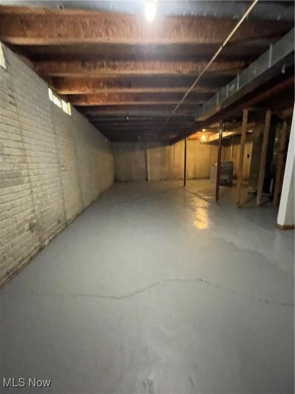 unfinished basement with brick wall