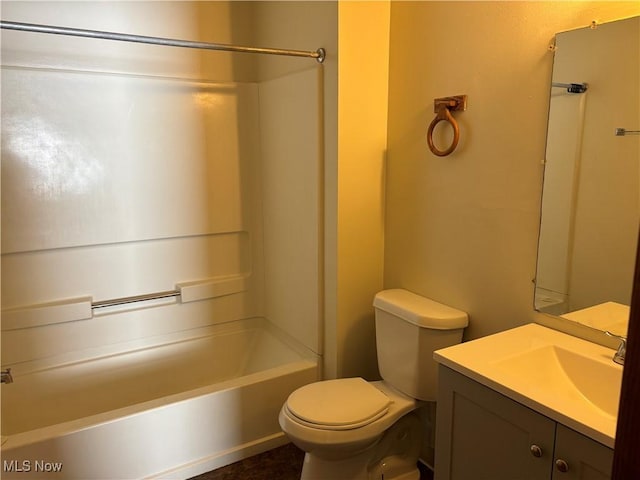 bathroom featuring vanity, bathing tub / shower combination, and toilet