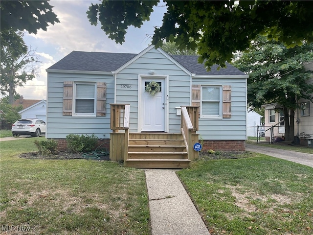 bungalow with a front yard