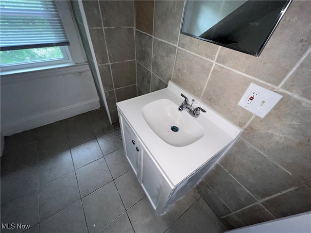 bathroom featuring vanity, tile walls, tile patterned floors, and decorative backsplash