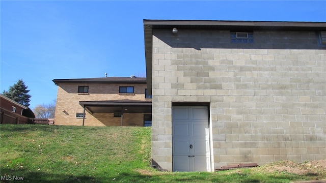 rear view of house featuring a lawn