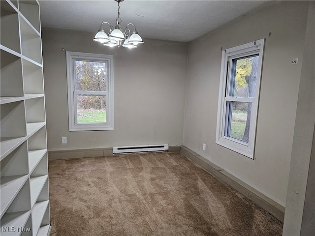 unfurnished dining area featuring baseboards, a notable chandelier, a baseboard heating unit, and carpet flooring