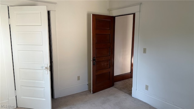 unfurnished bedroom with light carpet