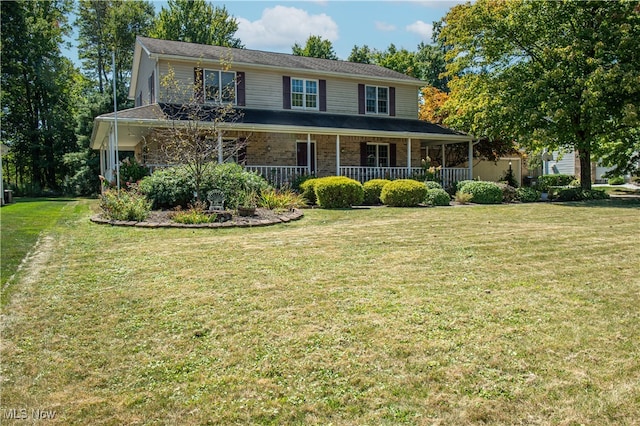 view of front facade with a front lawn and covered porch