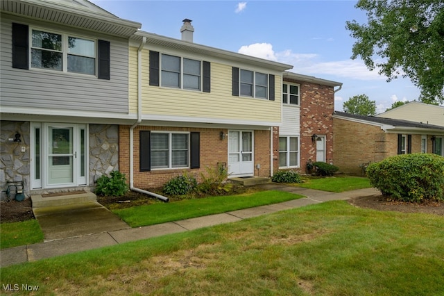 view of front of property with a front lawn