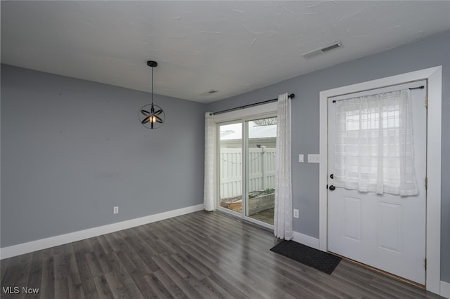 entrance foyer with dark hardwood / wood-style flooring