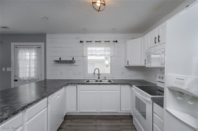 kitchen featuring white appliances, sink, tasteful backsplash, dark hardwood / wood-style flooring, and white cabinetry