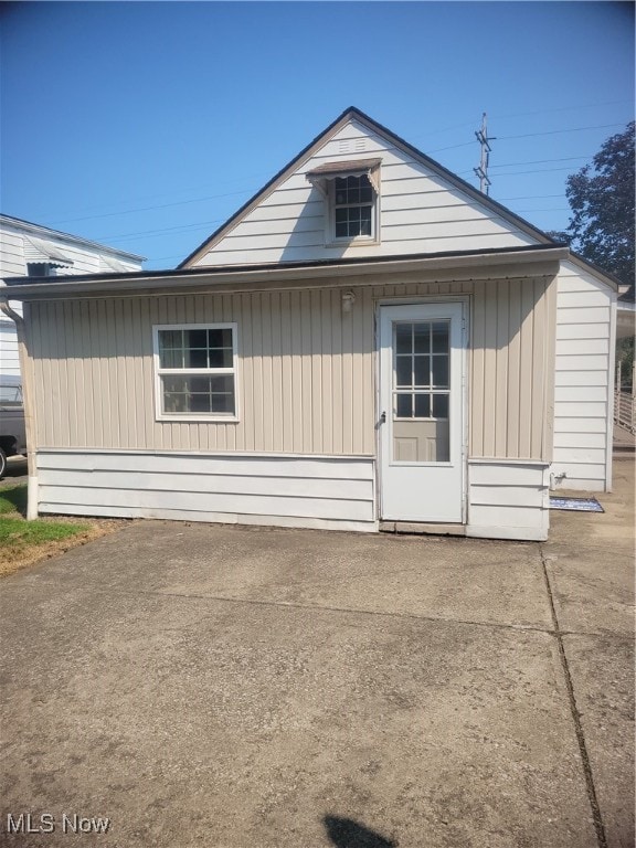 back of property featuring a patio