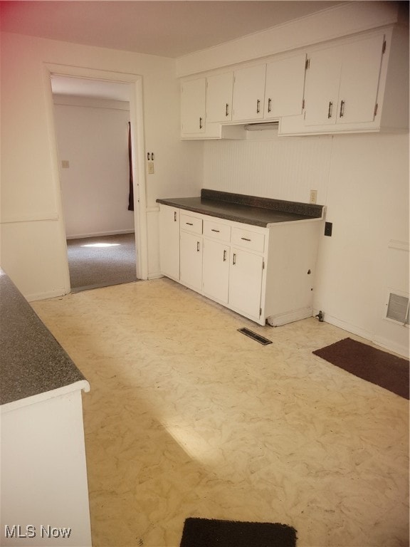 kitchen with white cabinets