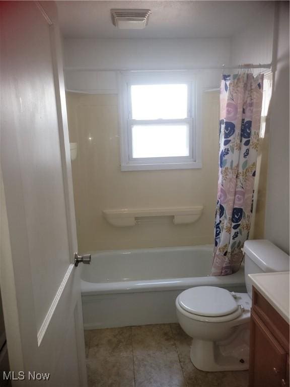 full bath featuring visible vents, toilet, shower / tub combo with curtain, tile patterned flooring, and vanity