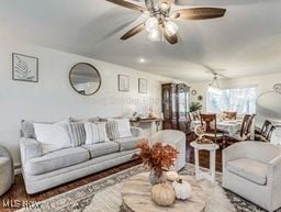 living room featuring ceiling fan