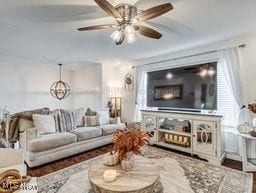 living room with ceiling fan and hardwood / wood-style floors