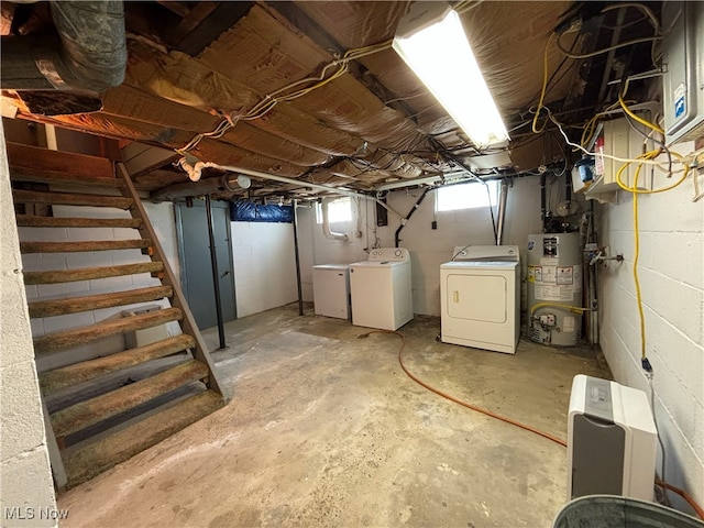 basement featuring washer and clothes dryer and gas water heater