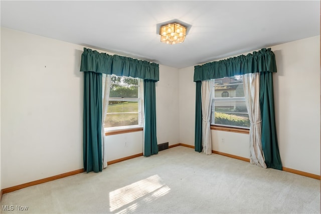 empty room with light colored carpet