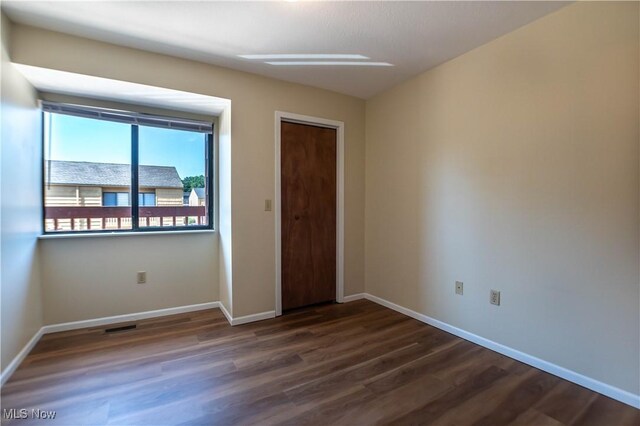 interior space with dark hardwood / wood-style floors