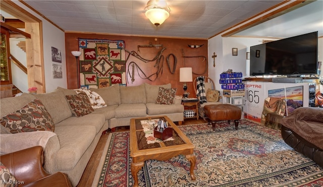 living room featuring crown molding and hardwood / wood-style floors