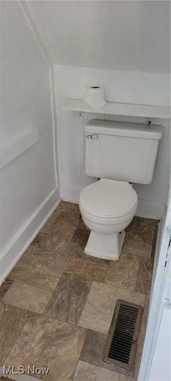 100 Phillips St, Marietta, OH 45750 - bathroom with baseboards, visible vents, stone finish floor, and toilet