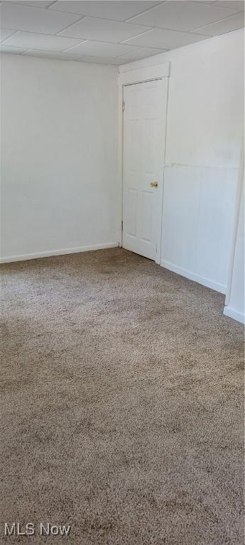 100 Phillips St, Marietta, OH 45750 - empty room featuring baseboards, carpet flooring, and a paneled ceiling