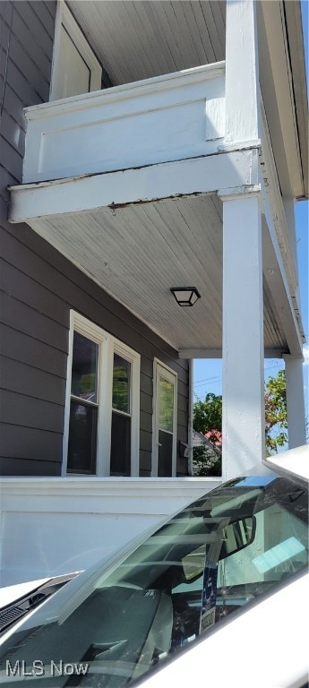 exterior space featuring wooden walls and wooden ceiling