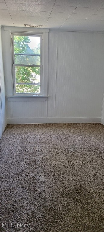 empty room with carpet flooring