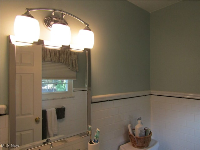 bathroom with tile walls