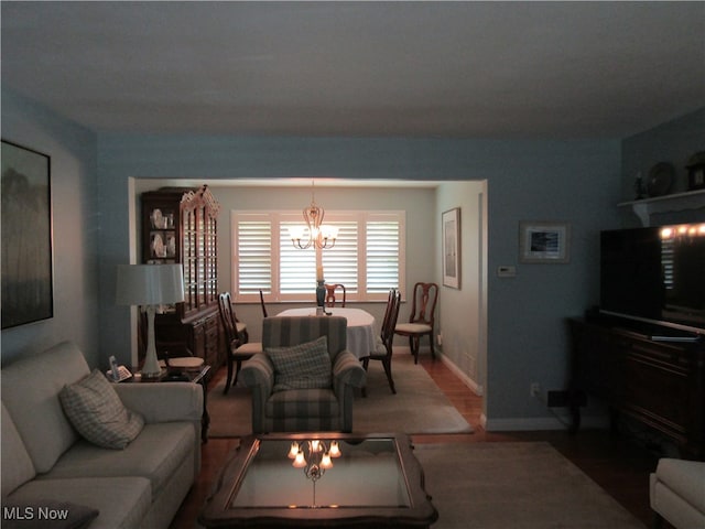 living room featuring a notable chandelier