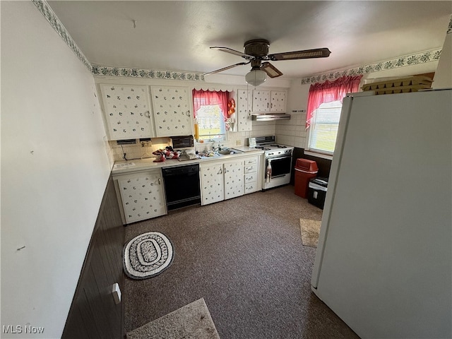 kitchen featuring dark colored carpet, tasteful backsplash, ceiling fan, and white appliances