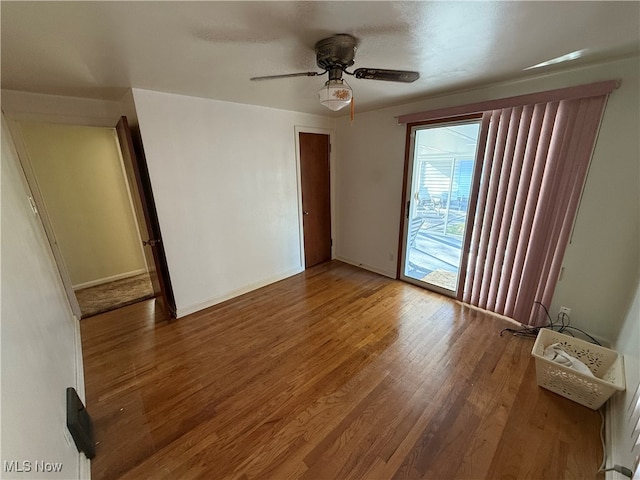 unfurnished room featuring hardwood / wood-style flooring and ceiling fan