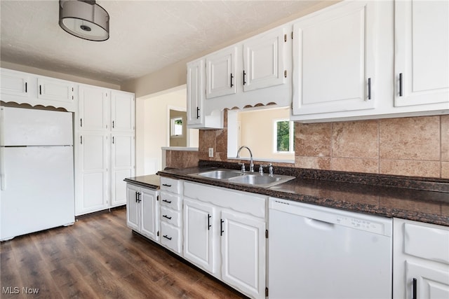 kitchen with white appliances, sink, and white cabinets